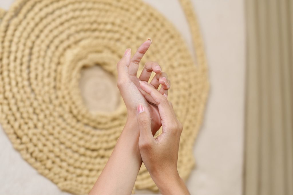 Touching hands of woman, refined beautiful female hands, clean and well groomed skin